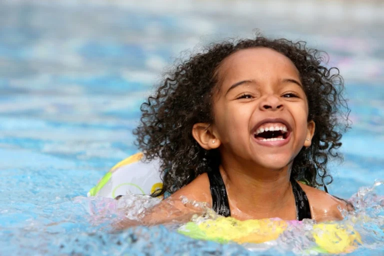 jubilant kid swimming in a pool picture id