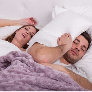 man with pillow on head in bed picture id